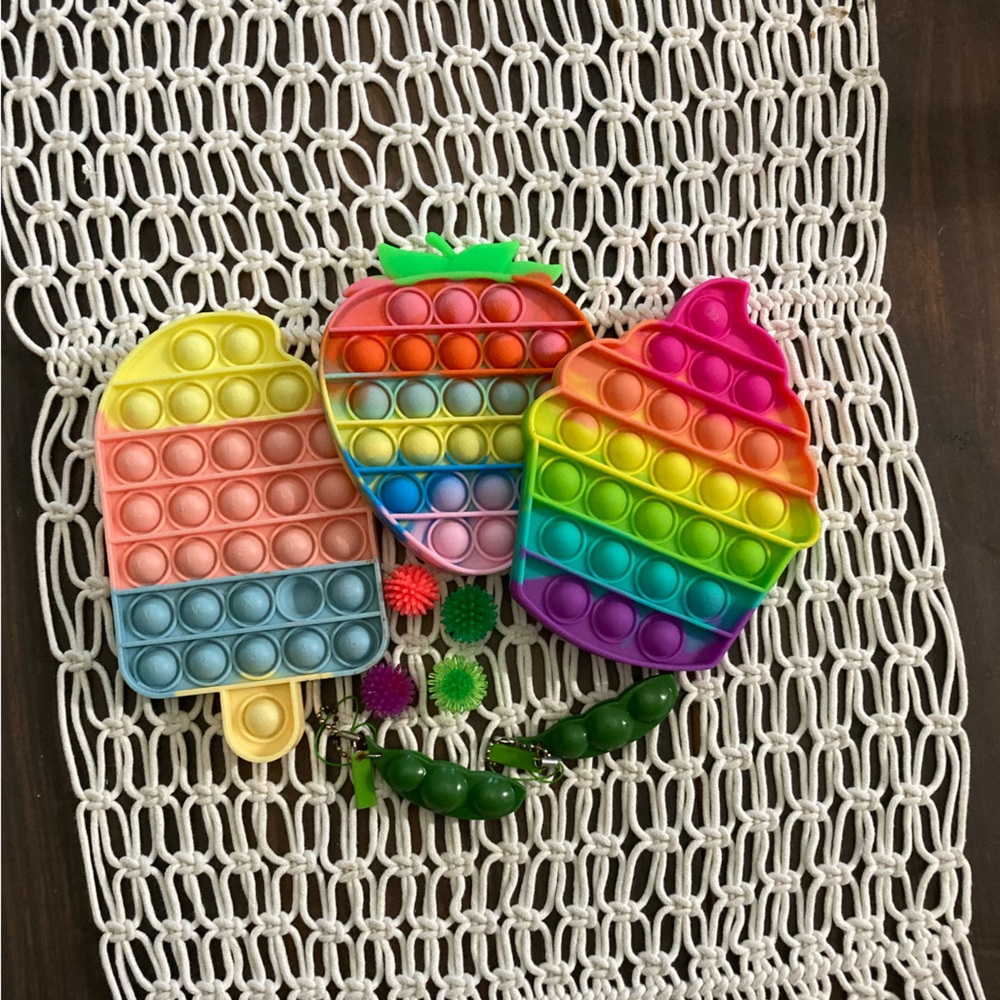 Popsicle pop it, cupcake pop it, strawberry pop it, 2 pea poppers, 4 spike balls